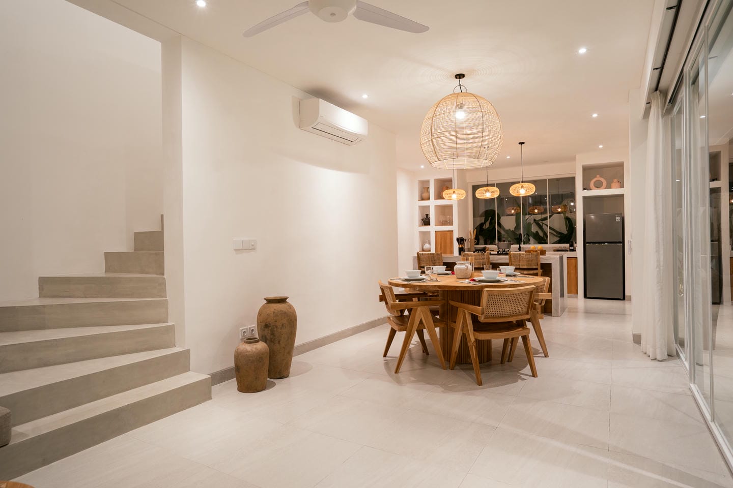 Modern dining room with wooden furniture and decor.