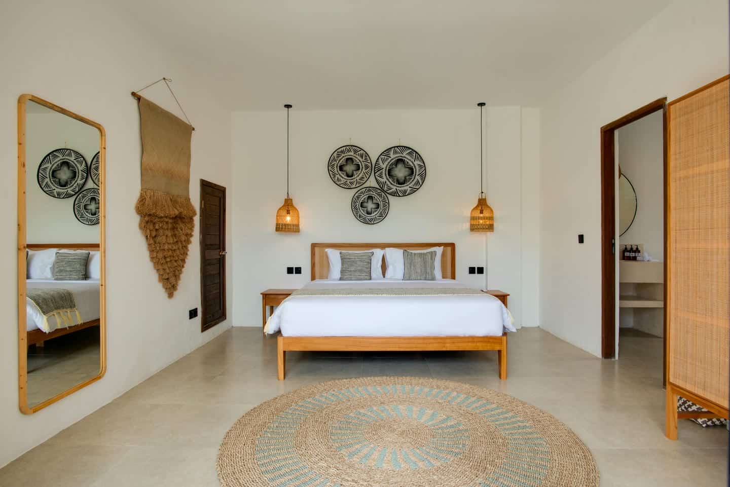 Modern bedroom with wooden furniture and decorative accents.
