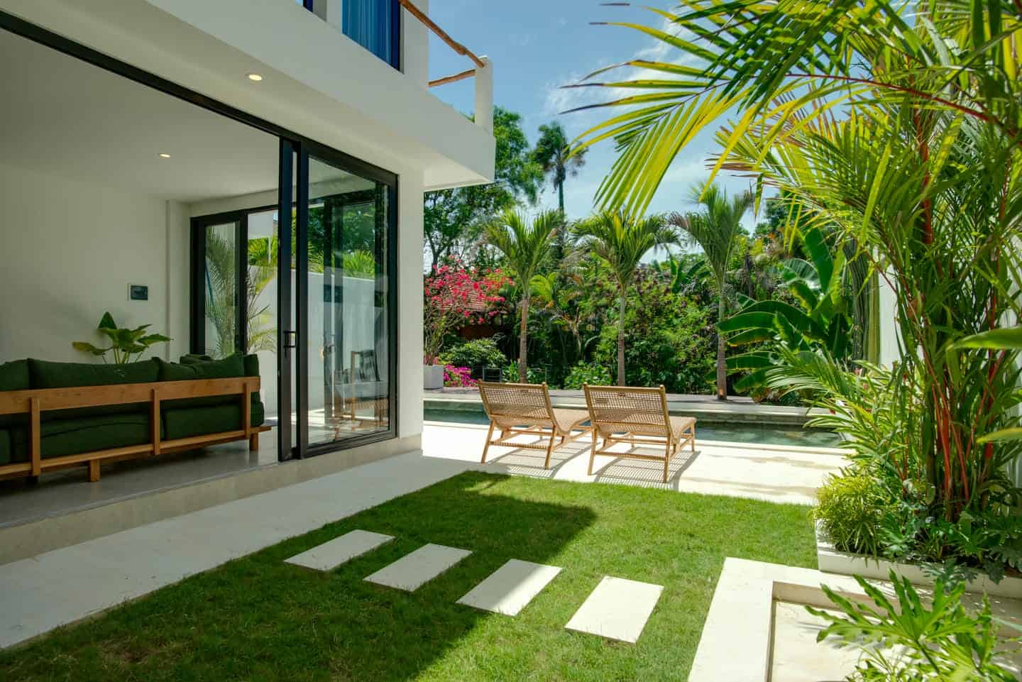 Modern patio with chairs and tropical plants