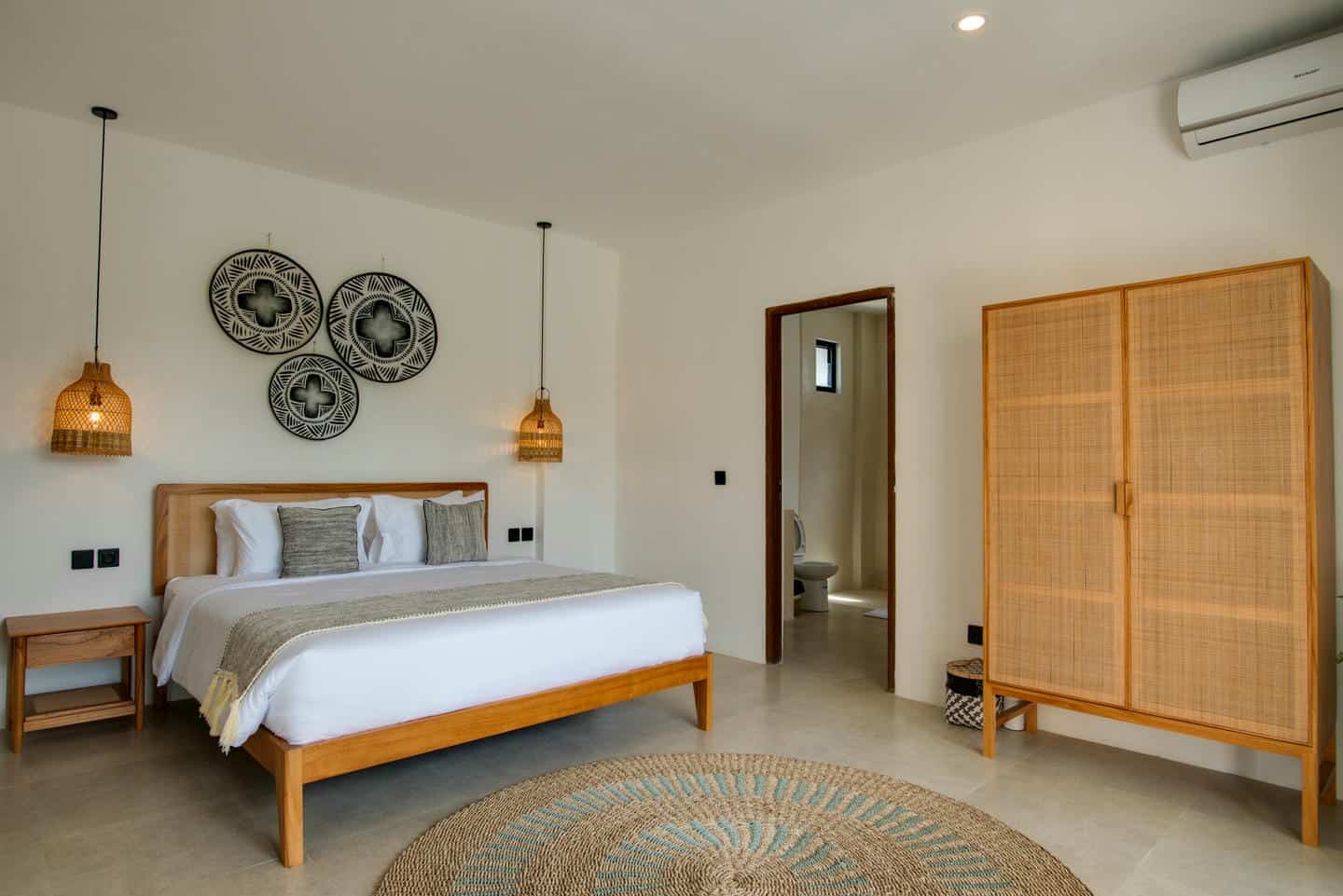 Modern bedroom with wood furniture and decor.