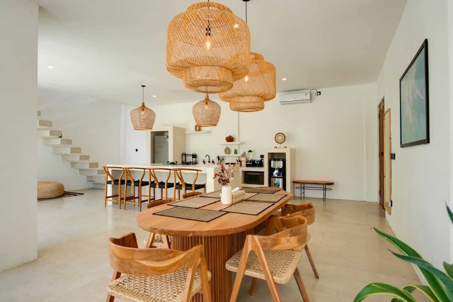 Modern open kitchen with wooden furniture and decor.