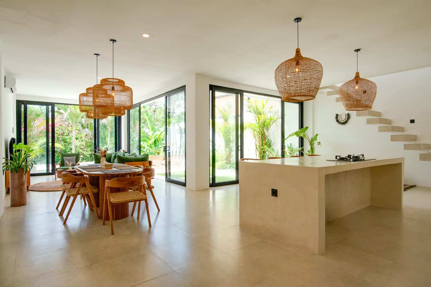 Modern open-plan kitchen and dining area with garden view.