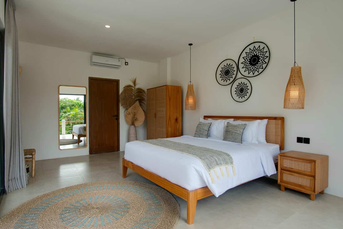 Modern bedroom with wooden furniture and decor elements.