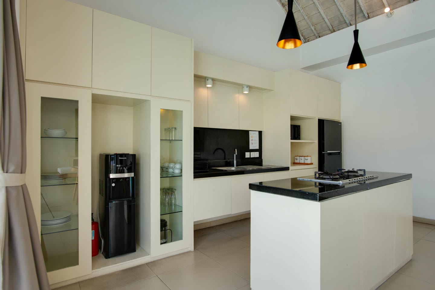 Modern kitchen with island and appliances.