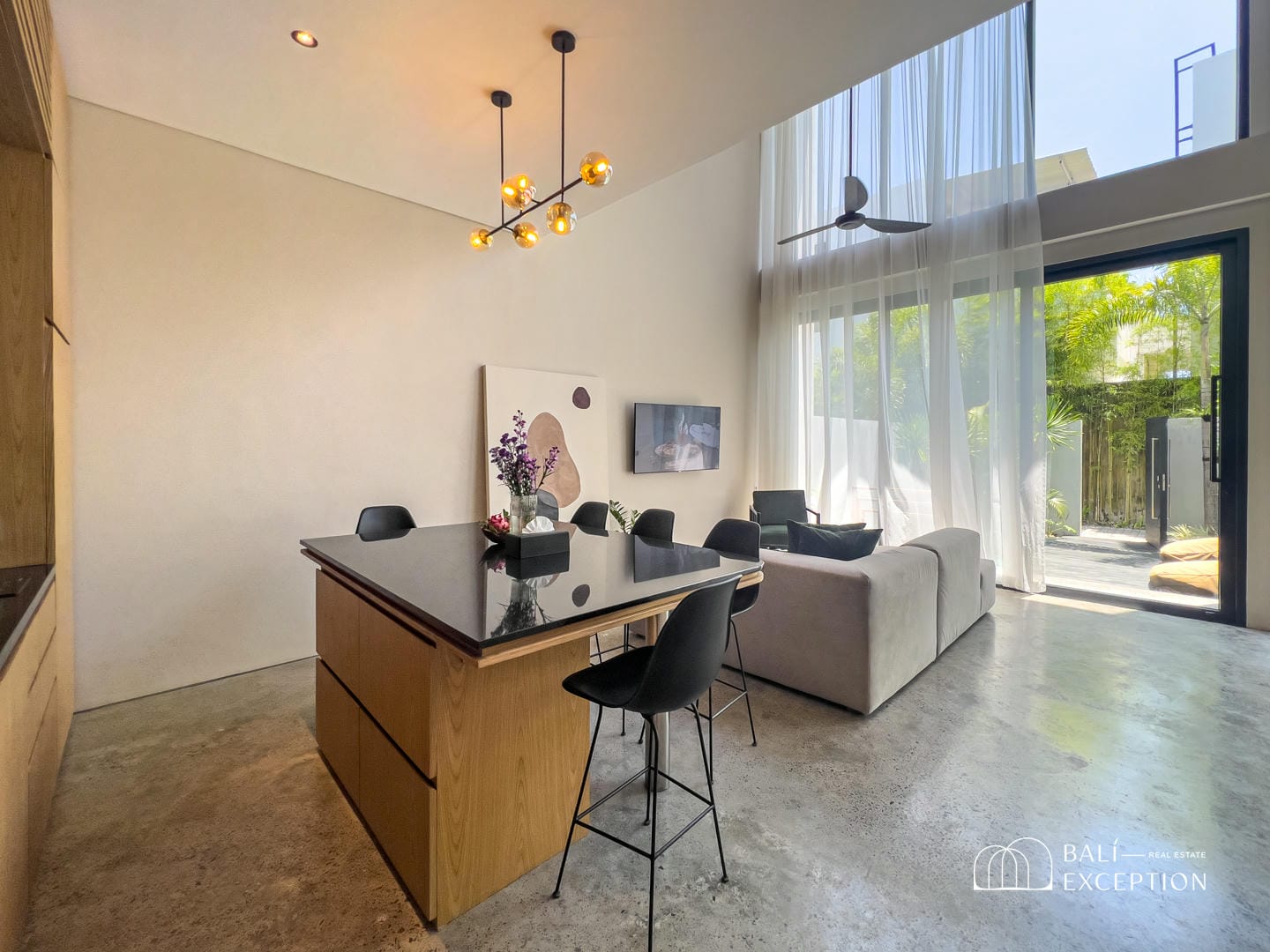 Modern living room with natural light and patio view.
