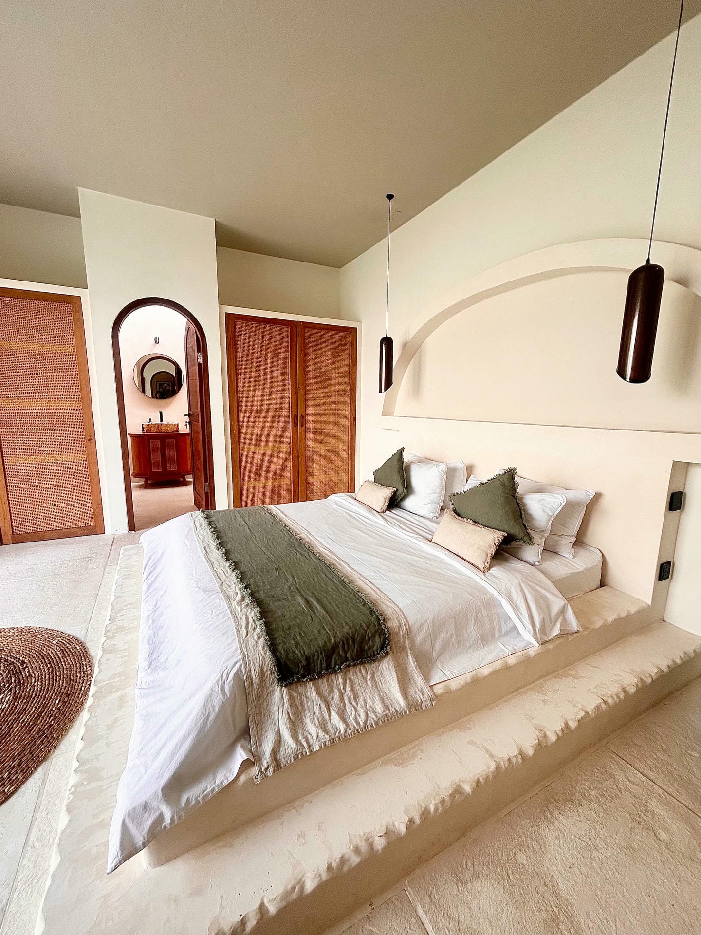 Bright bedroom with cozy bed and green accents