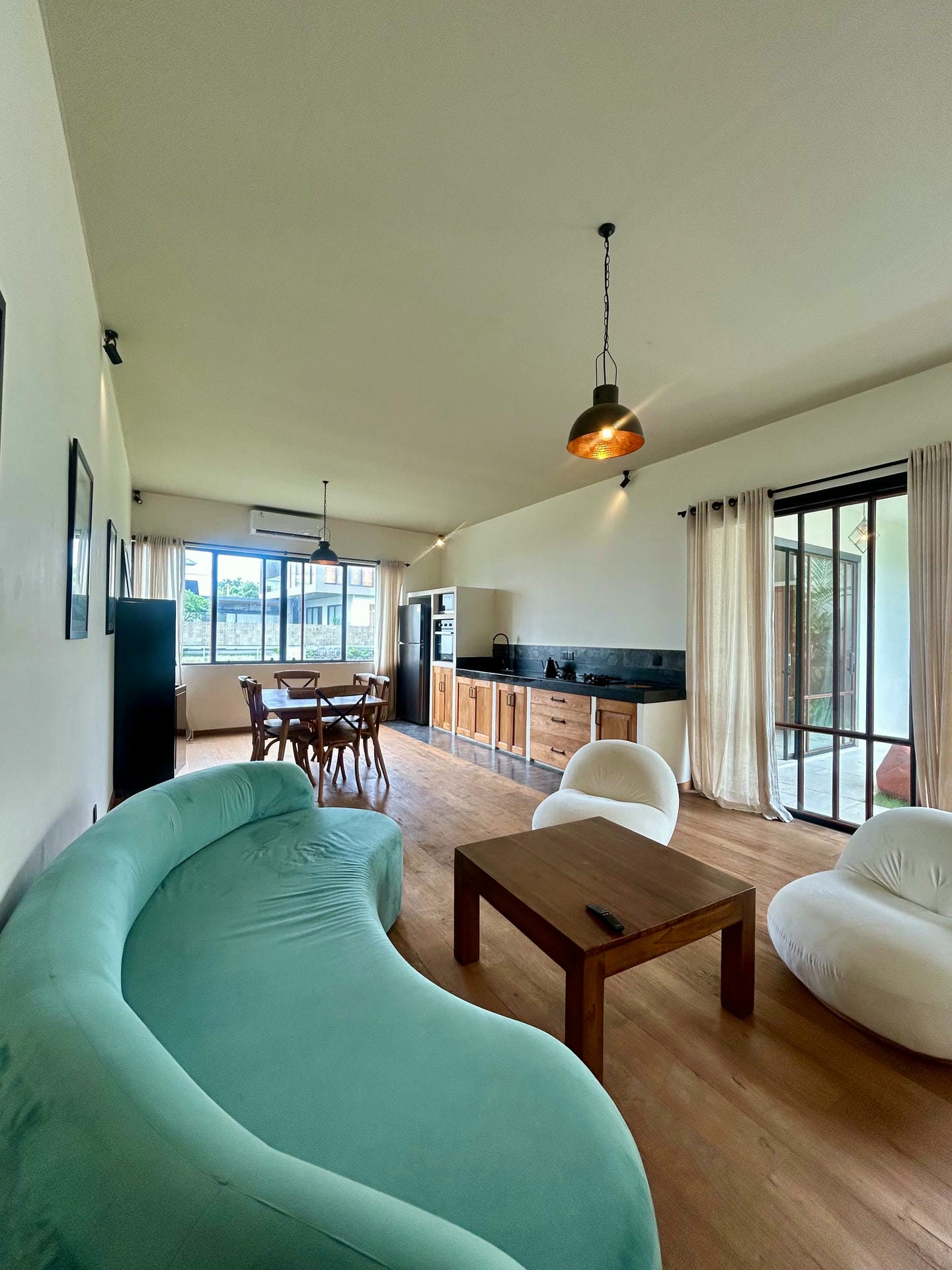 Spacious modern living room with unique furniture design.