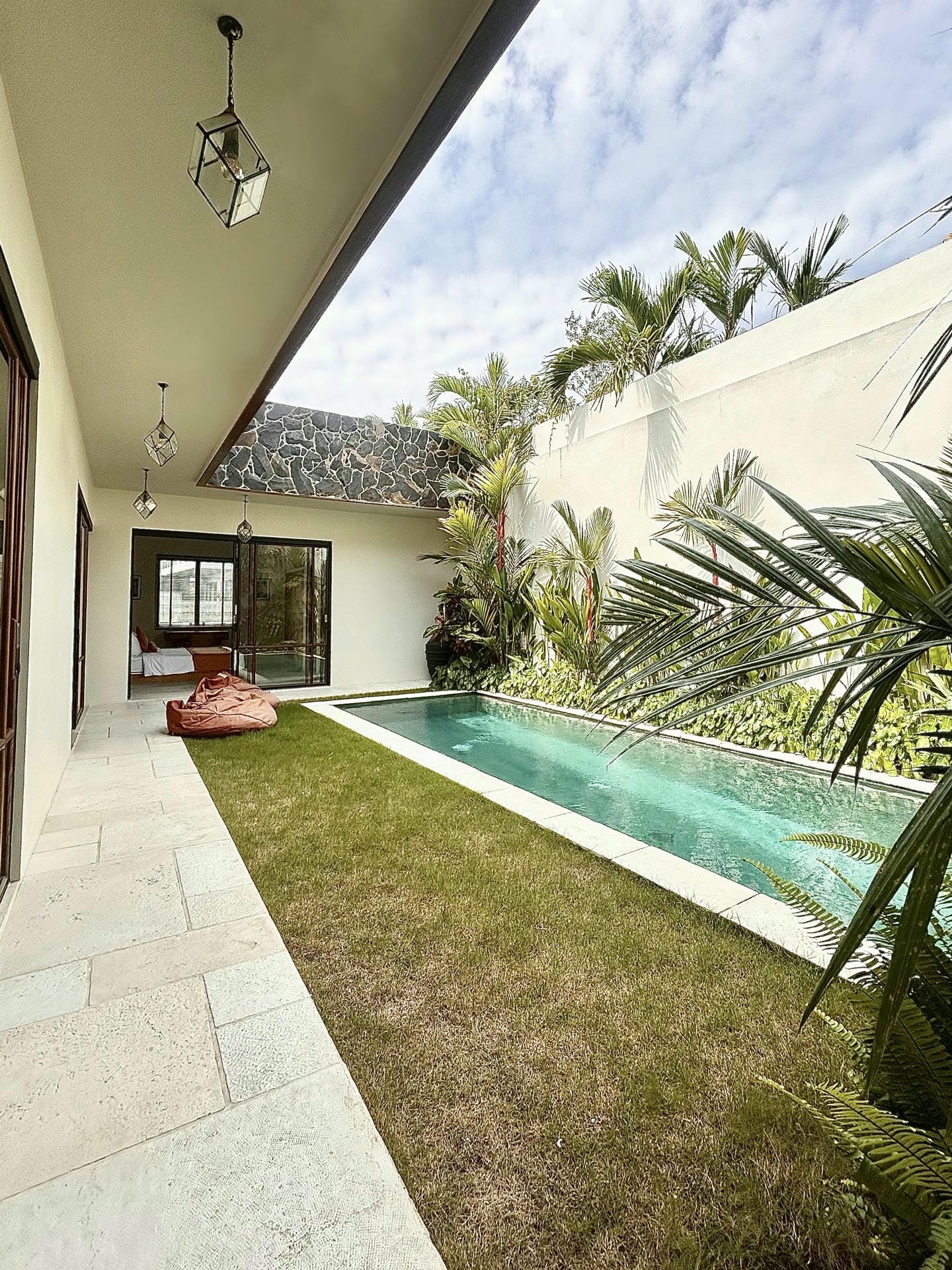 Modern backyard with pool and greenery