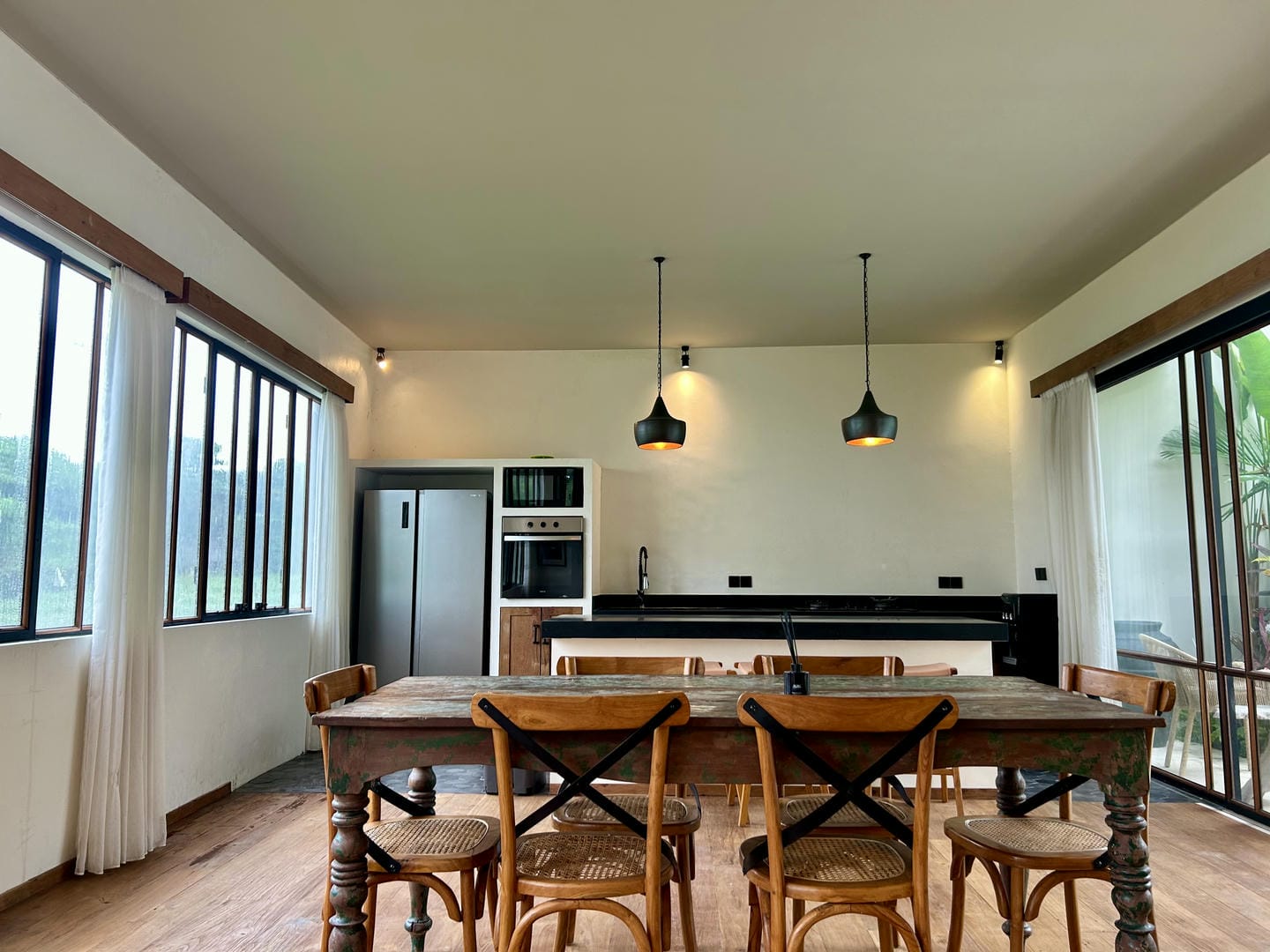 Rustic kitchen with wooden table and chairs