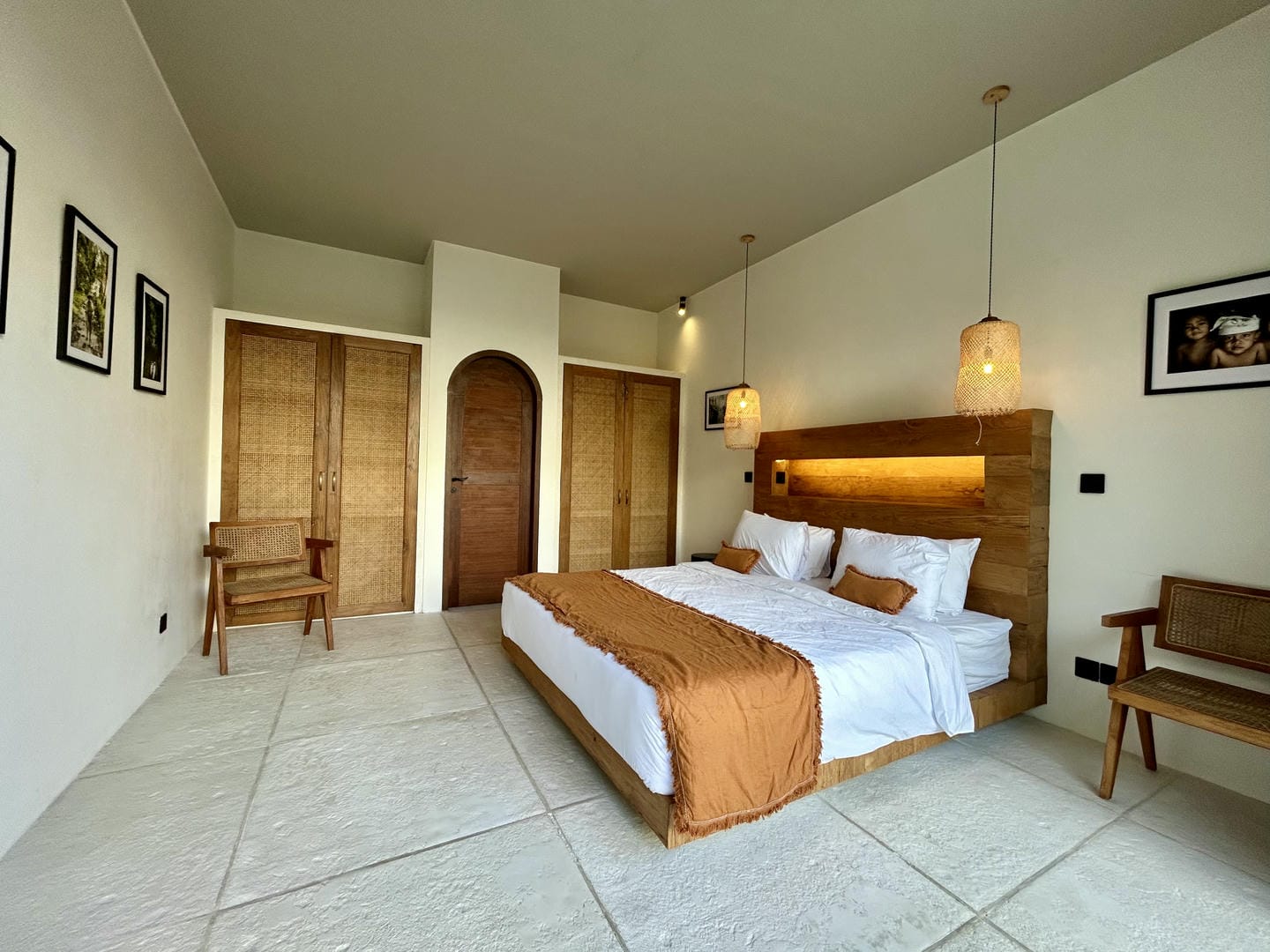 Cozy bedroom with wooden accents and artwork.