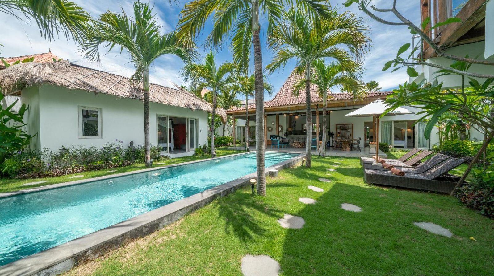 Tropical villa with pool and palm trees