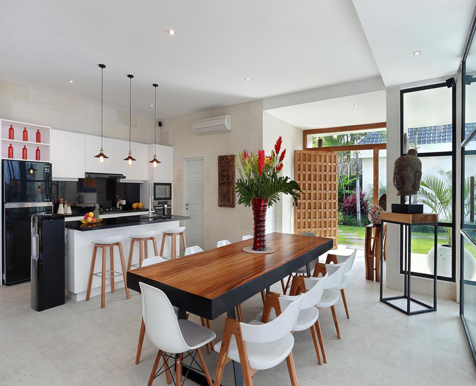 Modern open kitchen with island and dining area.