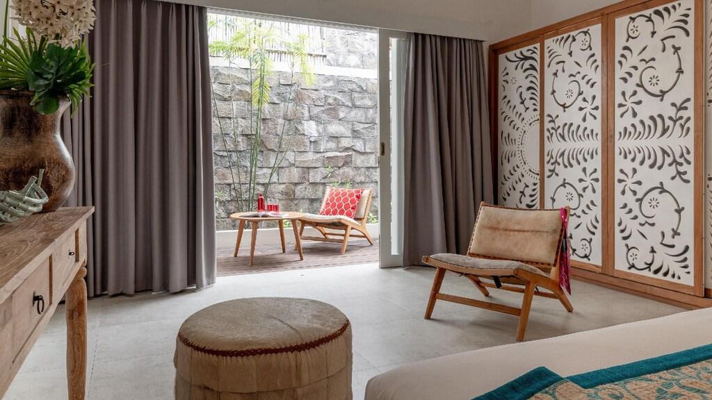 Cozy bedroom with patio access and decorative panels.