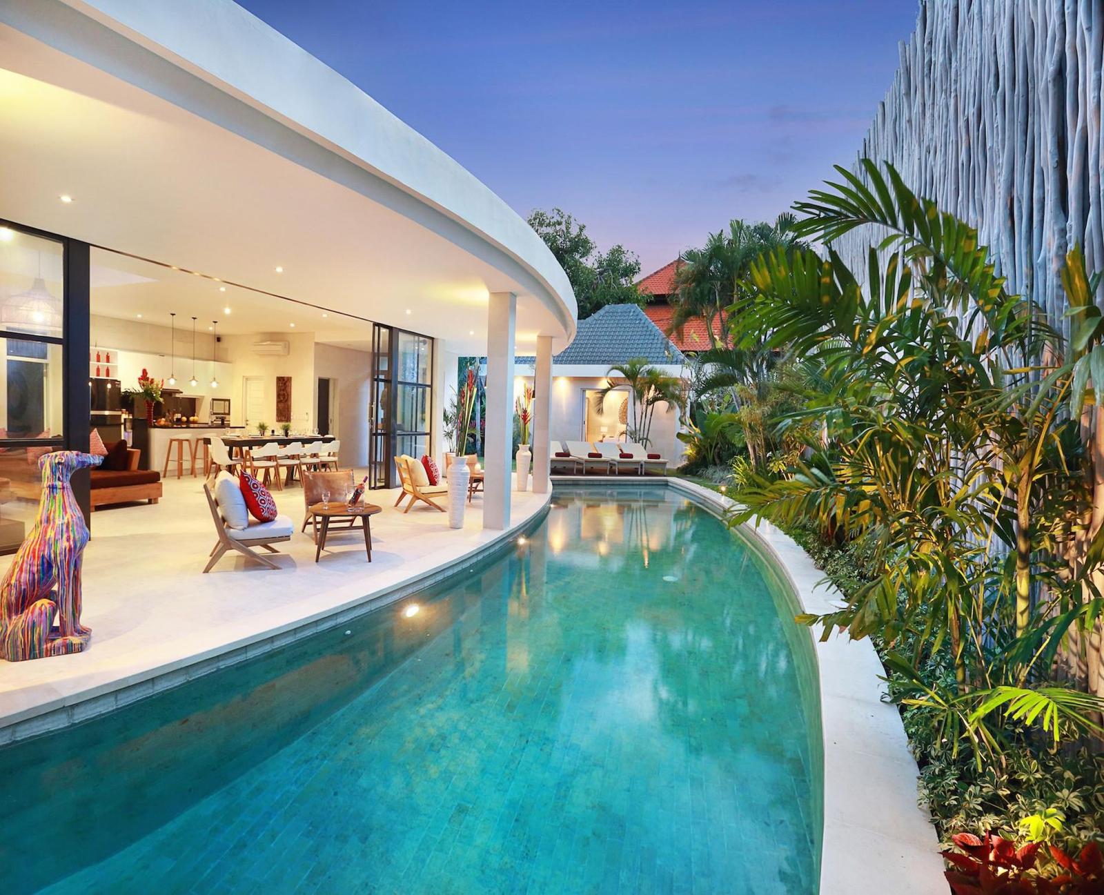 Luxurious villa with pool and open living area.