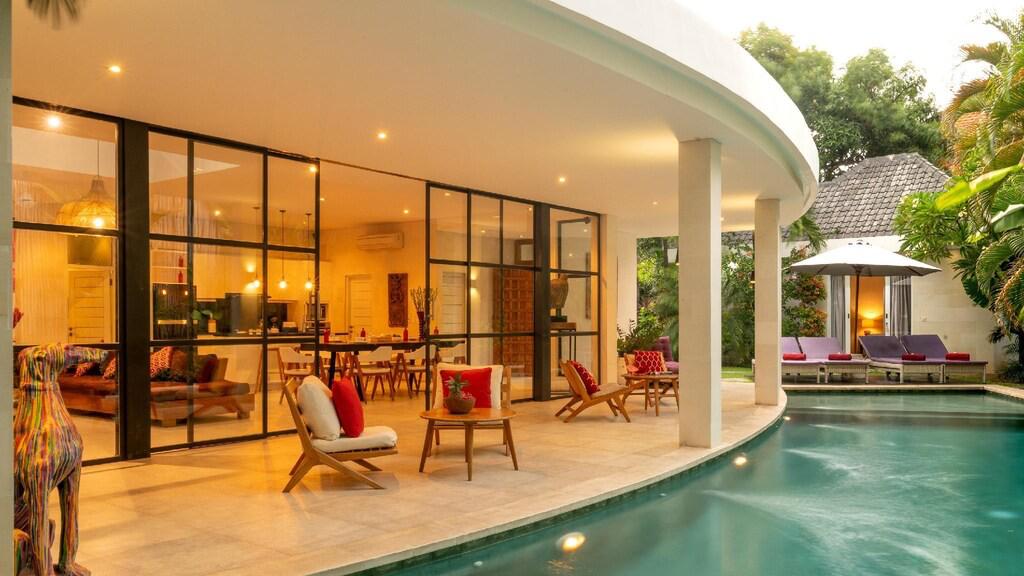 Luxury villa with pool and modern furniture.