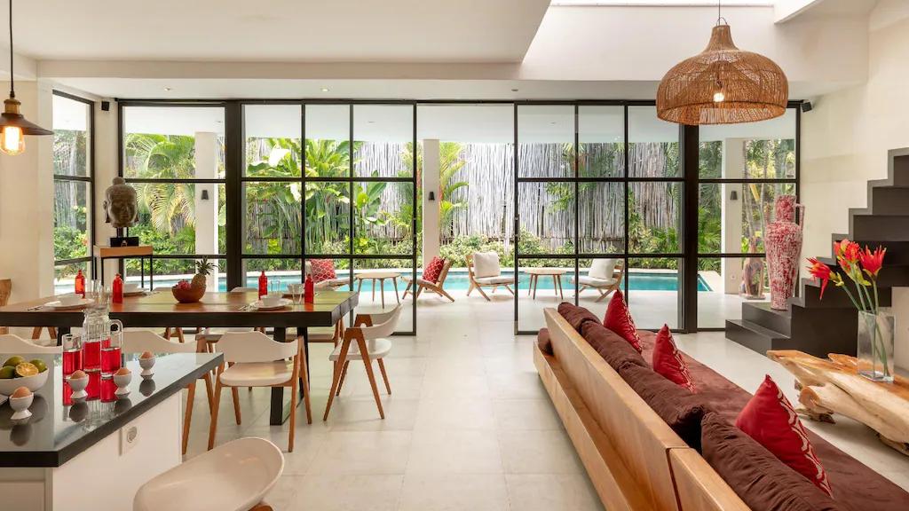 Modern living room with pool and garden view