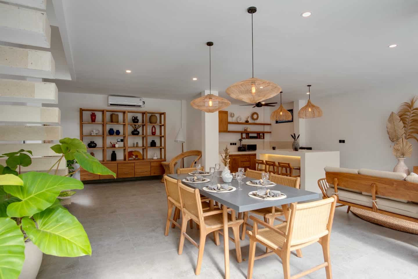 Modern dining room with wooden furniture and decor.
