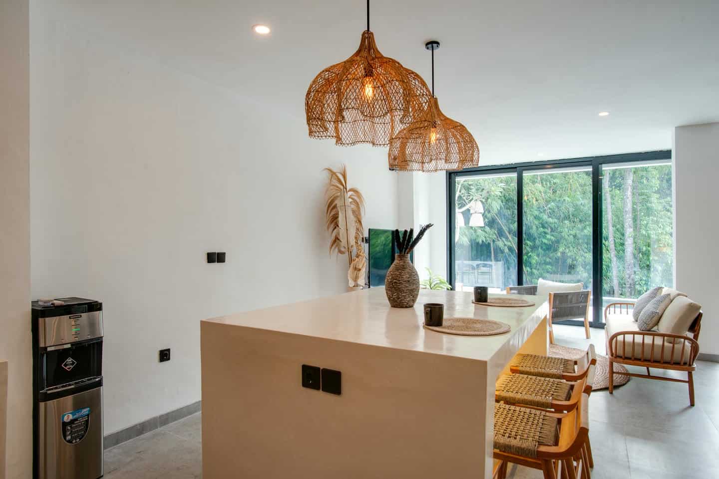 Modern kitchen with island and wicker chairs