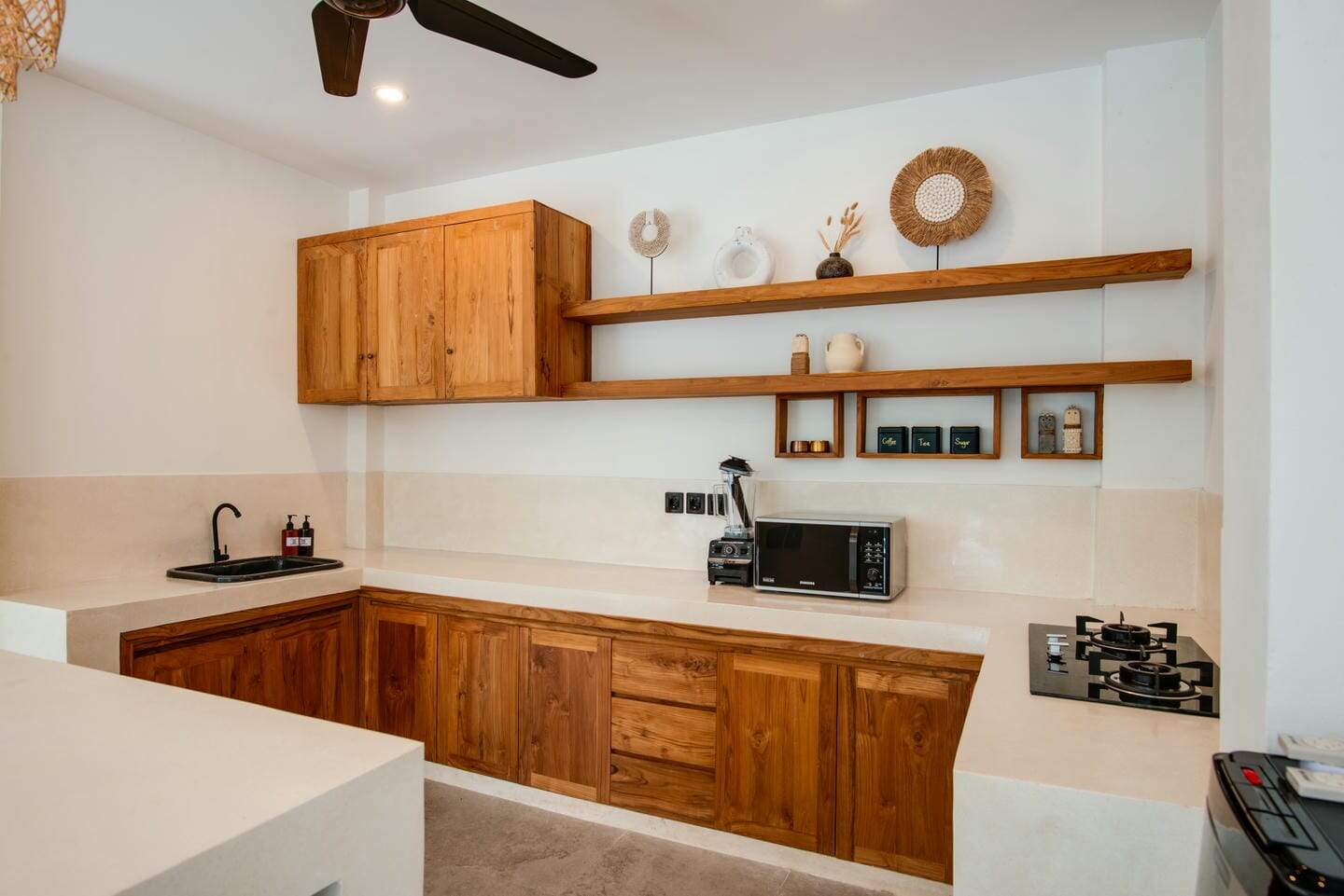 Modern kitchen with wooden cabinets and shelves.