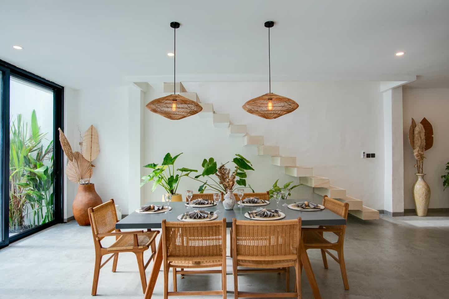 Modern dining room with plants and wooden decor