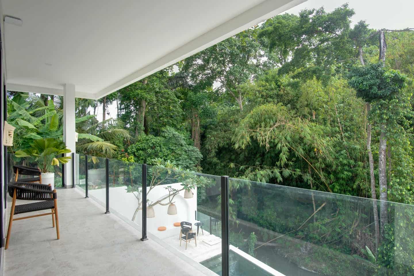 Modern balcony overlooking lush green forest