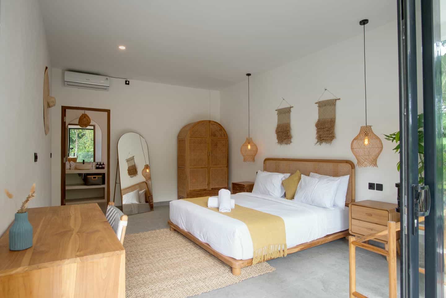 Stylish bedroom with natural wood and woven decor.