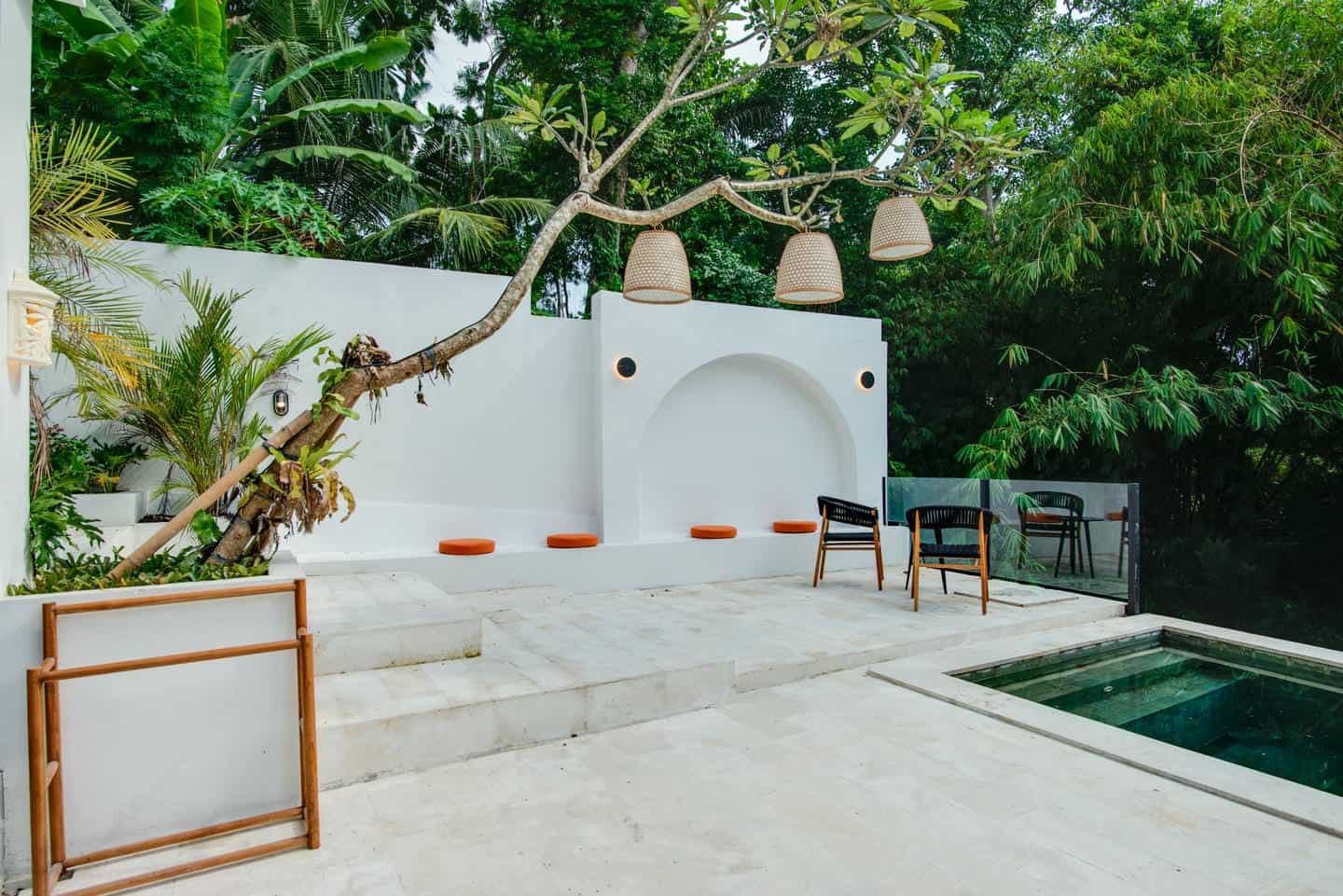 Modern patio with seating and greenery