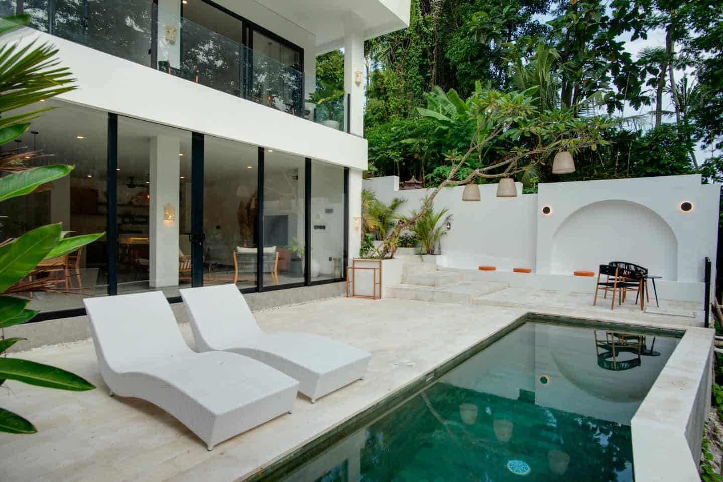 Luxury villa with pool and lounge chairs
