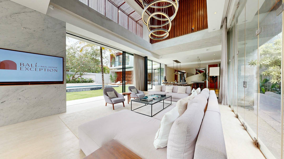 Modern spacious living room with garden view.