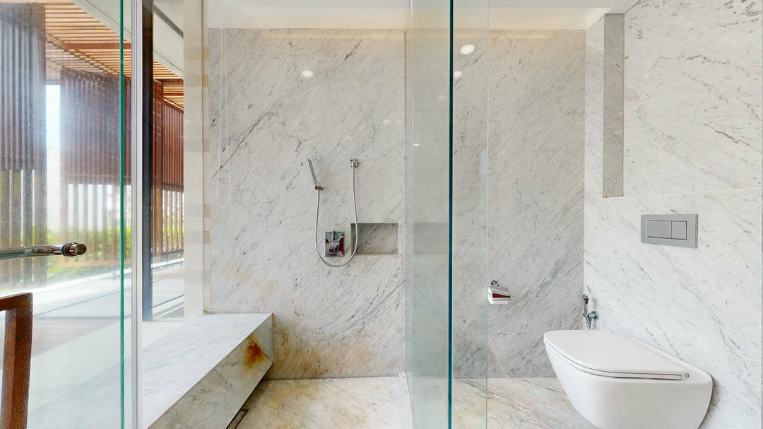 Luxury marble bathroom with glass shower.