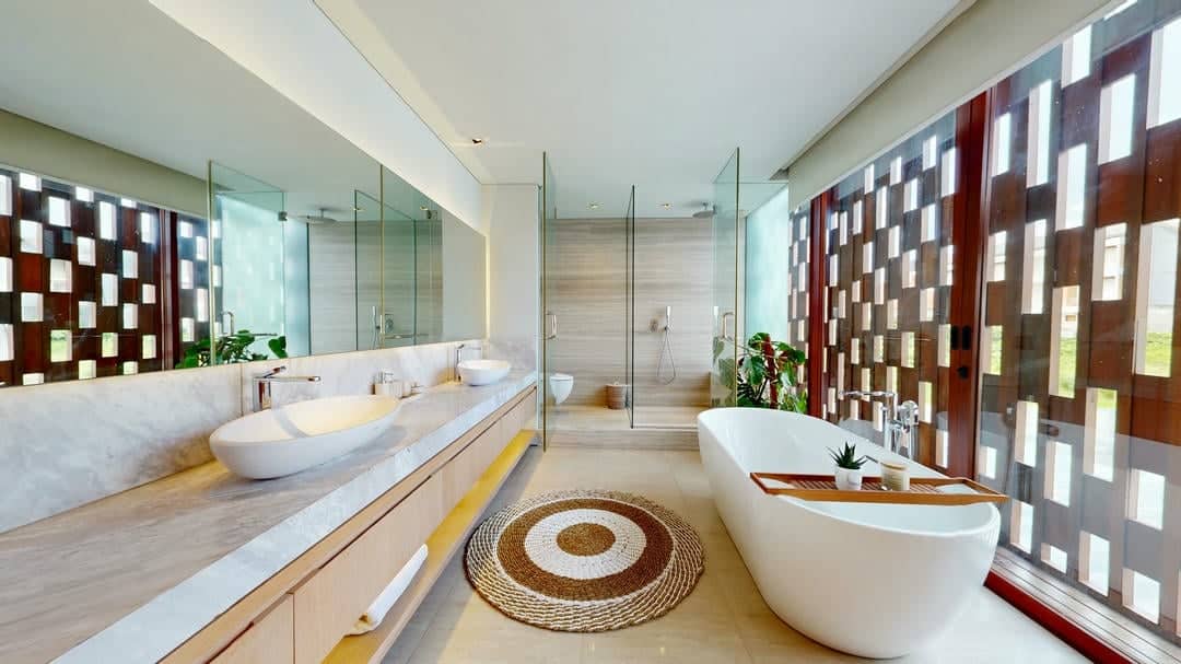 Modern bathroom with bathtub and glass shower.