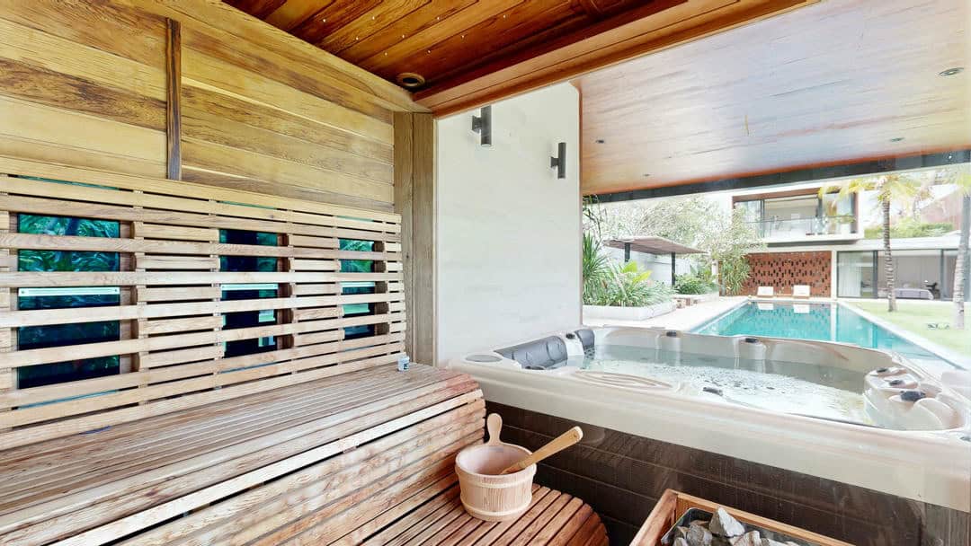 Luxury sauna with poolside view and jacuzzi