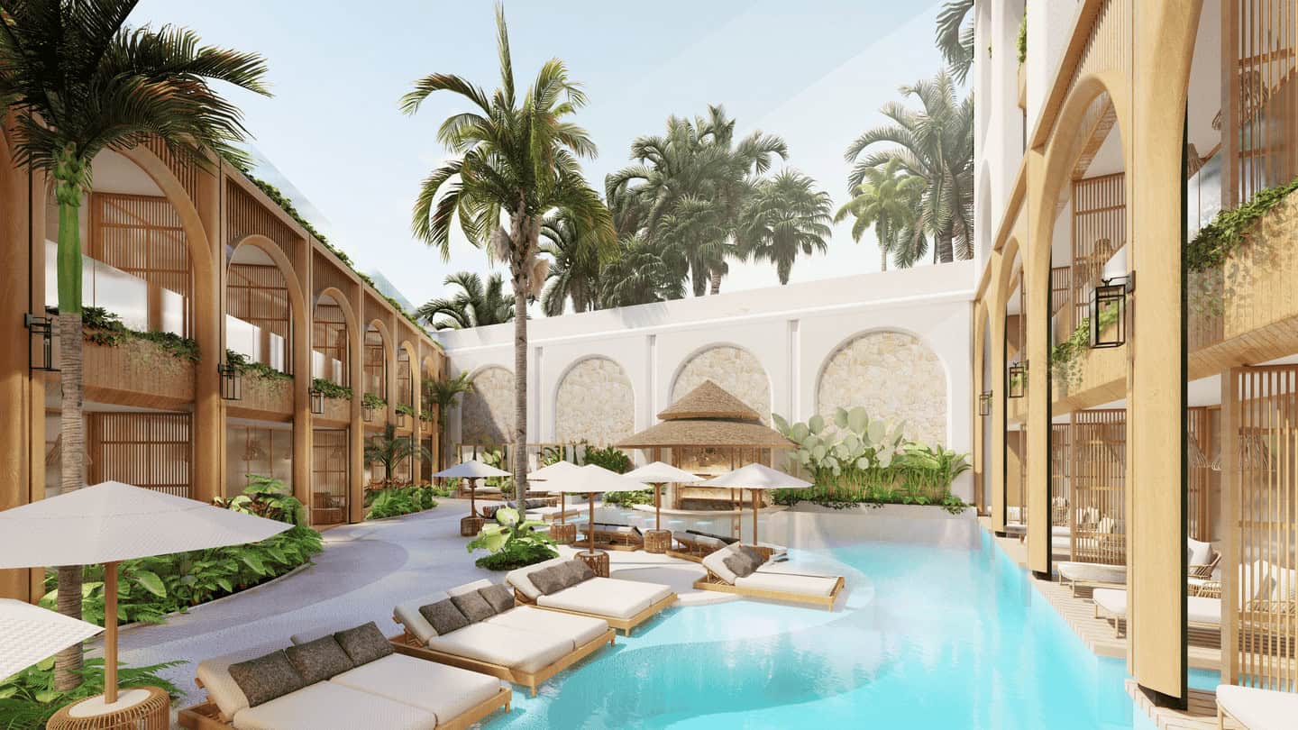 Luxurious resort courtyard with pool and palm trees.