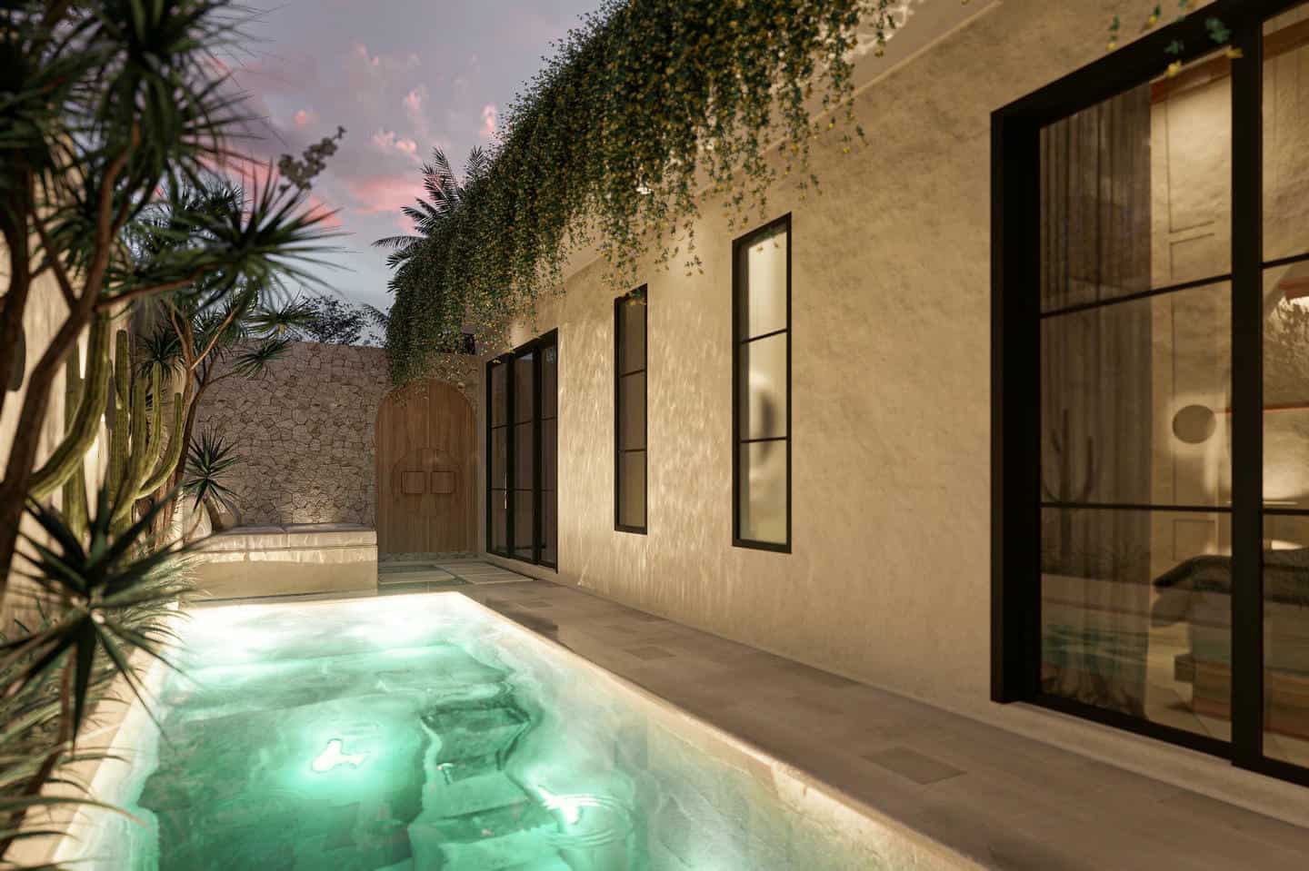 Modern courtyard with pool and greenery at sunset.