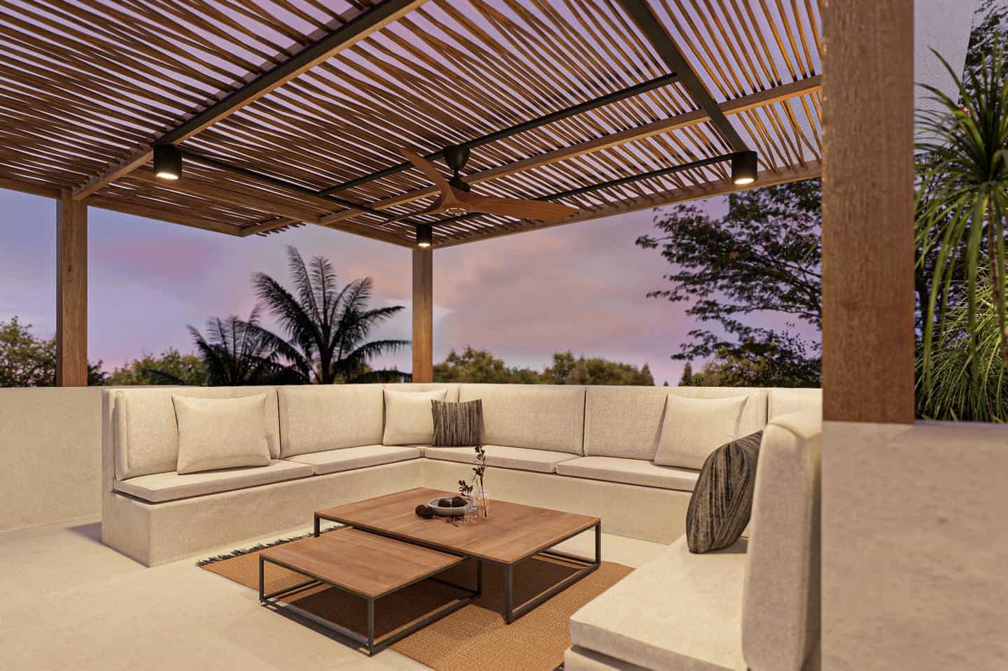 Outdoor patio with modern seating area, lush greenery
