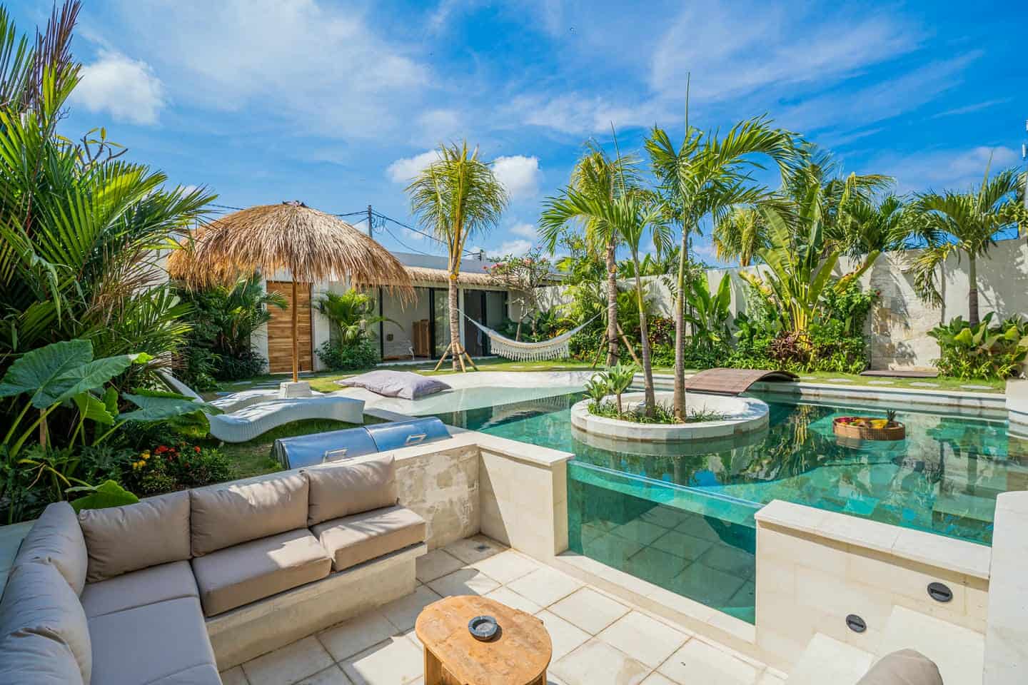 Luxury tropical villa with pool and garden.