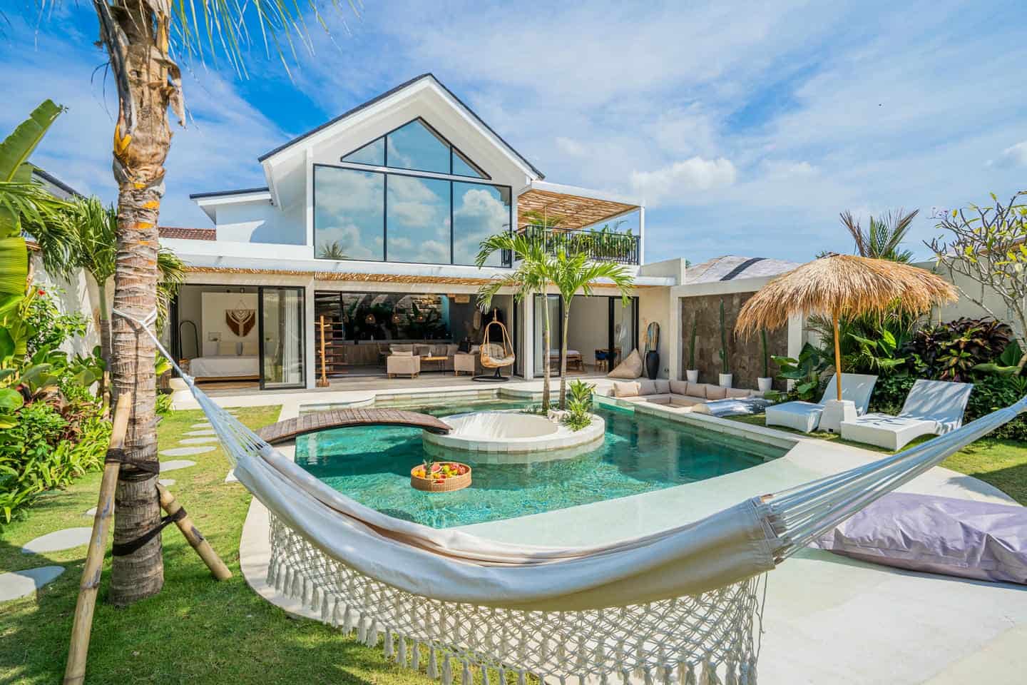 Luxurious villa with pool and hammock.