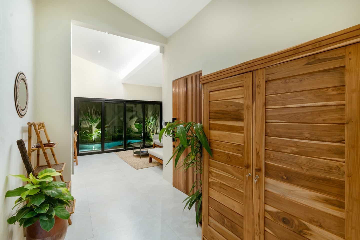 Spacious room with pool view and wooden decor