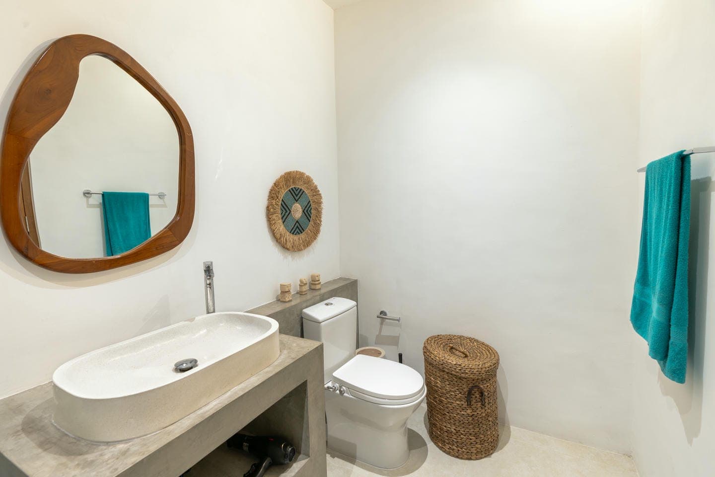 Modern bathroom with mirror and wicker basket