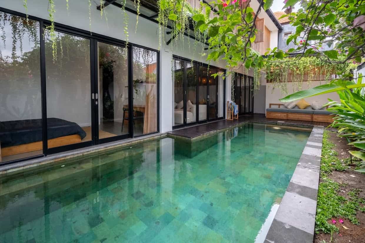 Modern villa with private pool and lush greenery