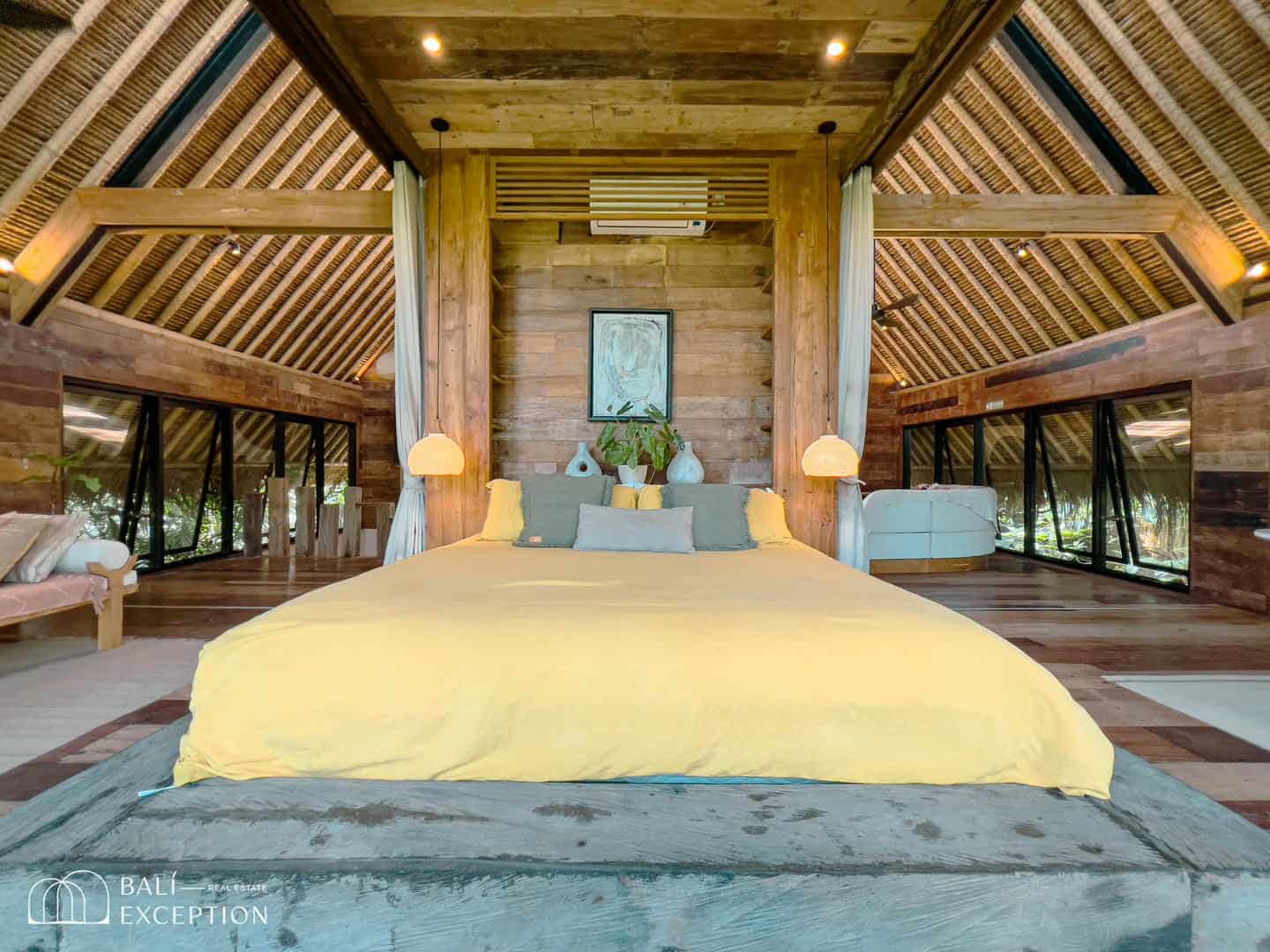 Cozy wooden bedroom with yellow bedspread