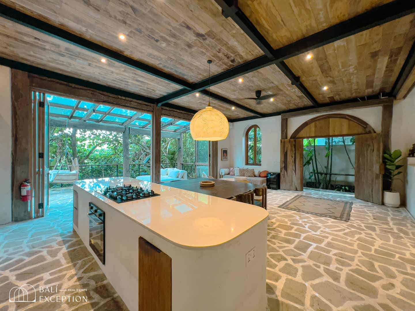 Rustic kitchen with island and overhead lighting