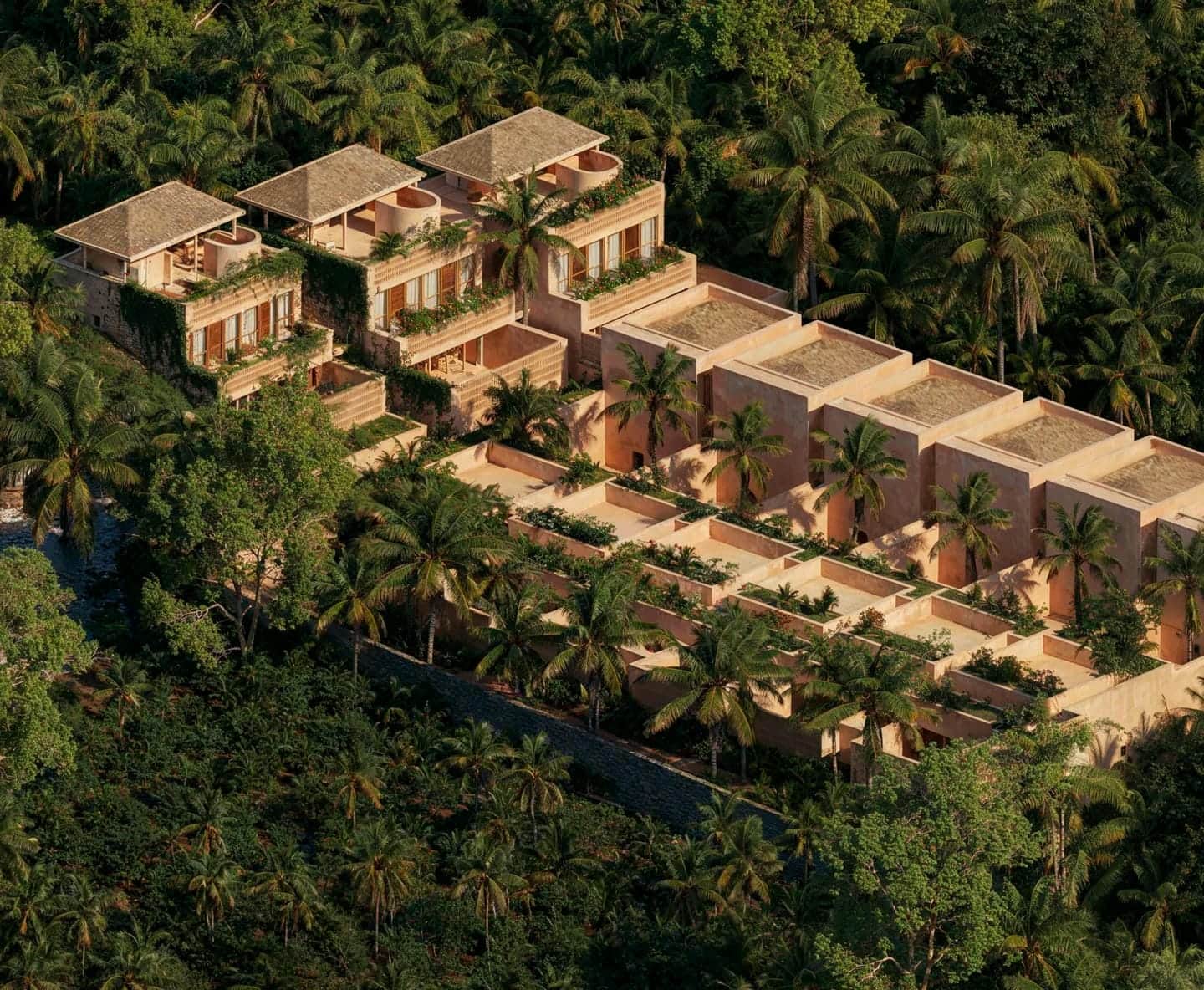 Luxury villas surrounded by lush tropical forest.