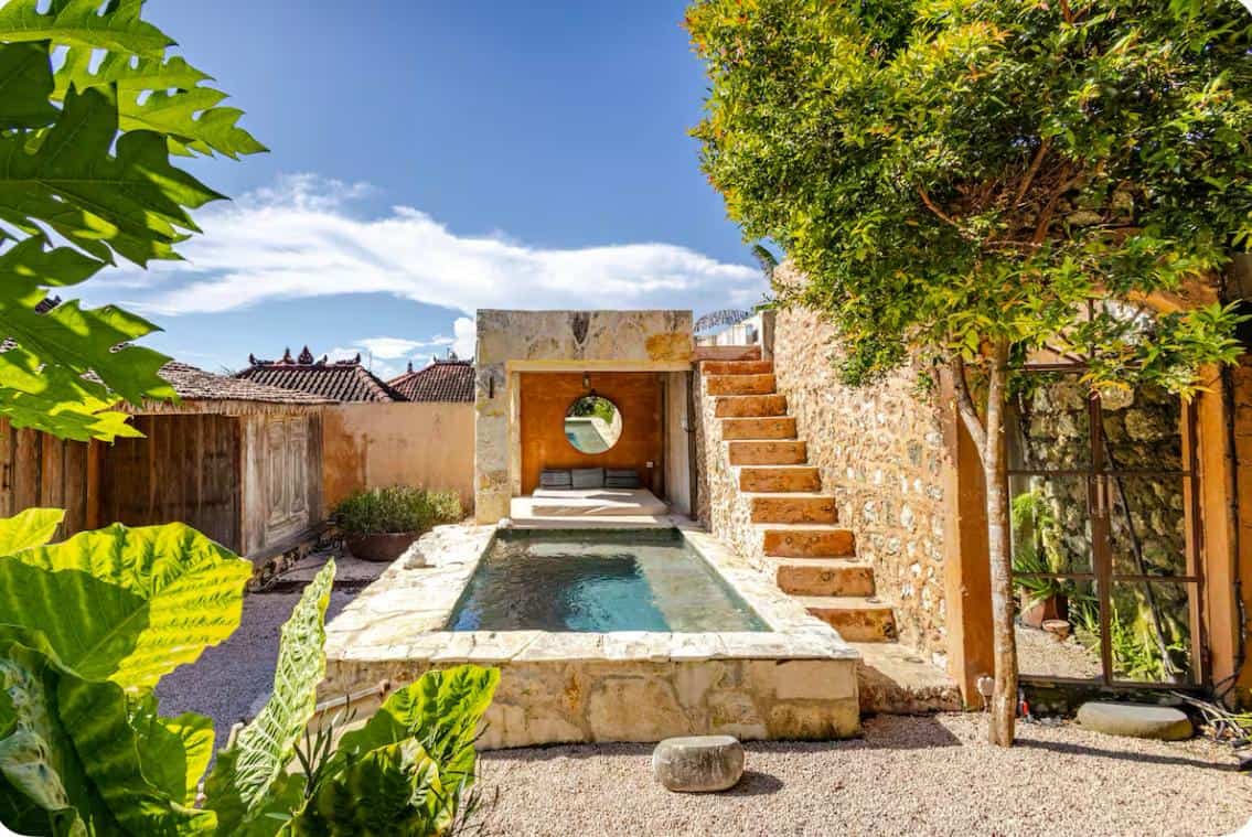Stone pool with stairs and plants