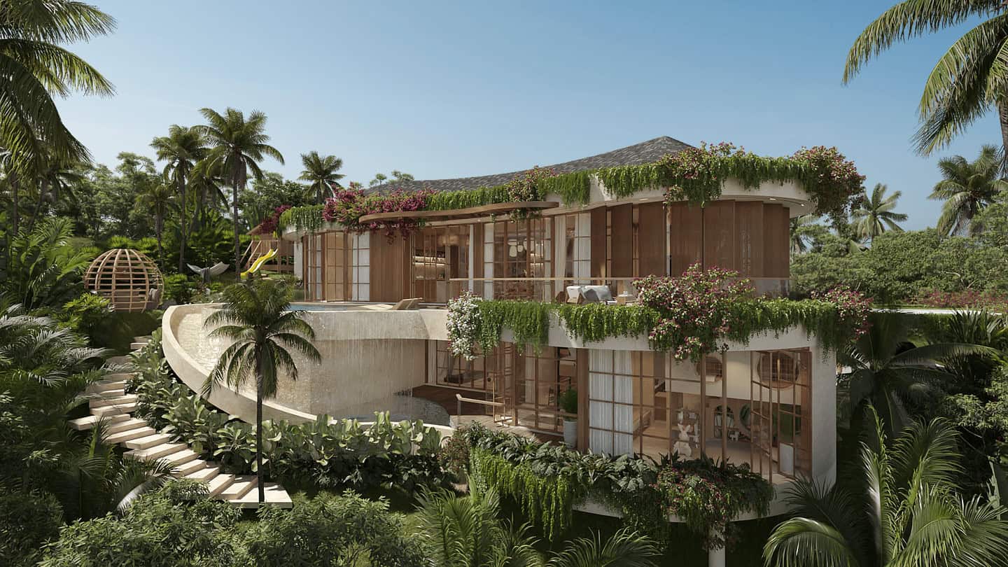 Luxurious eco-friendly tropical villa surrounded by lush greenery.