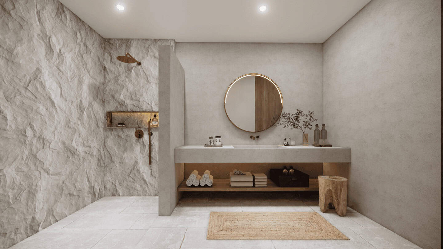 Modern minimalist bathroom with round mirror and stone wall.
