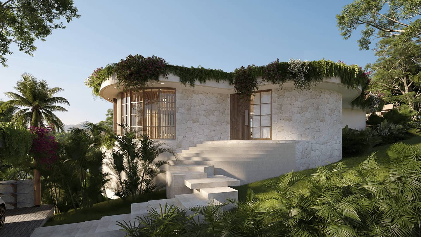 Modern stone house with lush green surroundings.
