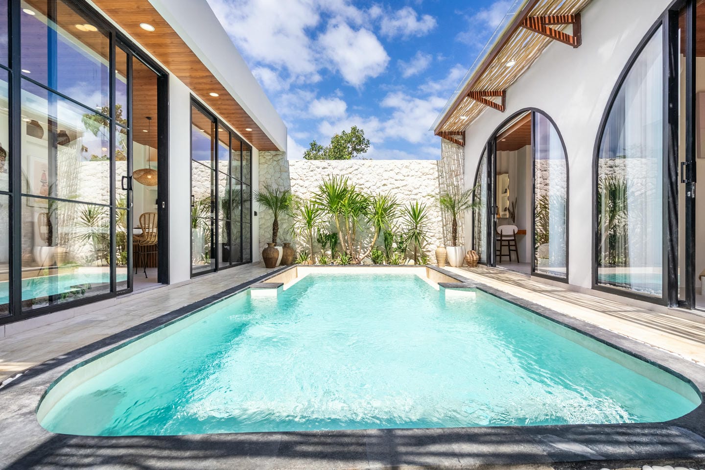 Modern villa with private pool and patio area.