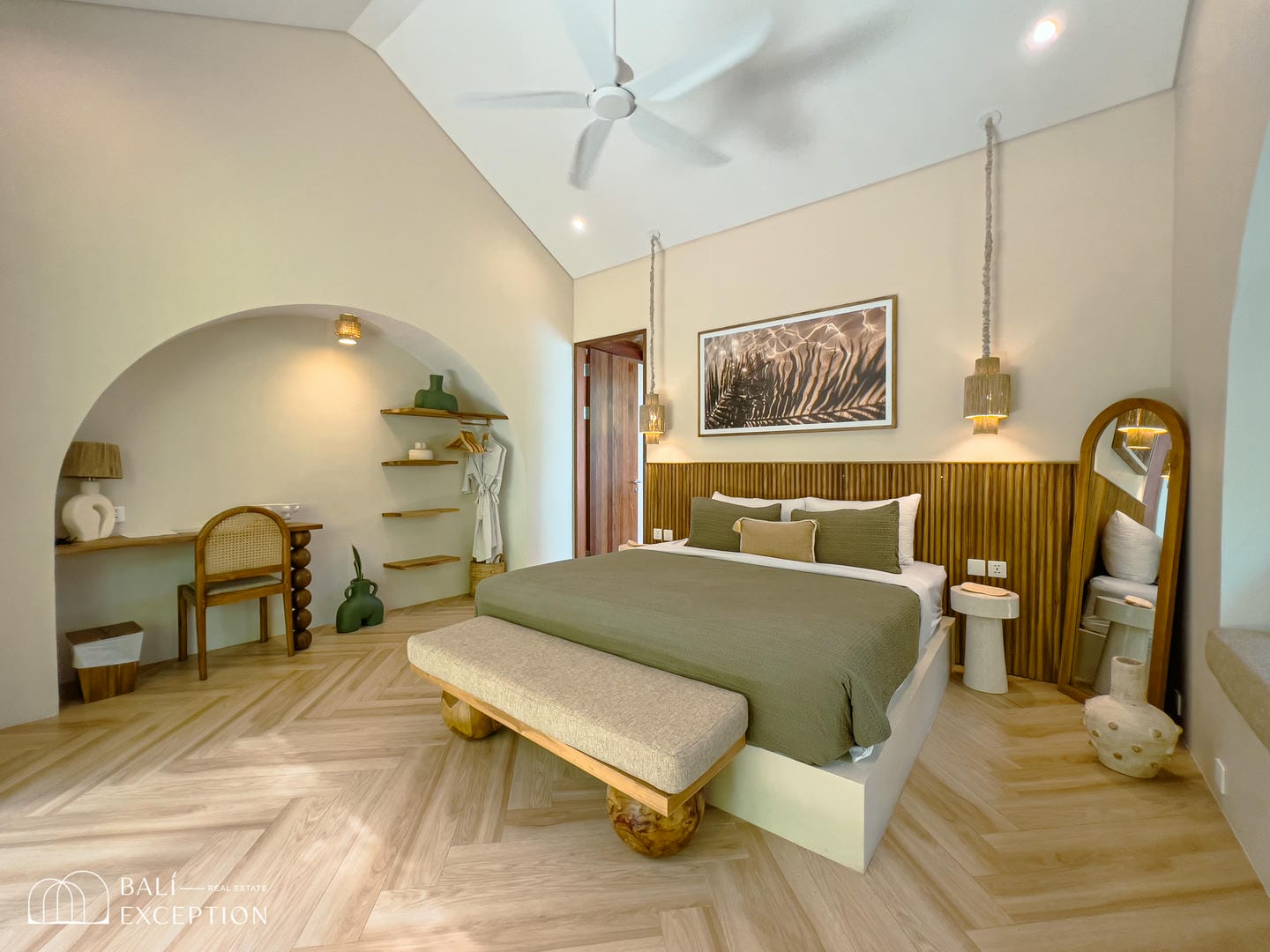 Modern bedroom interior with green accents and wood decor.