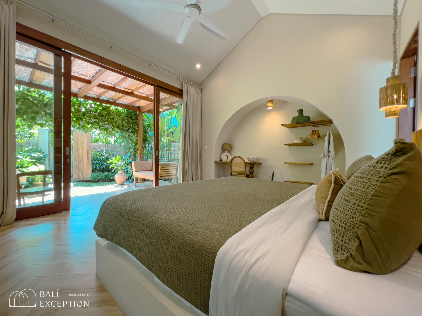 Cozy bedroom with garden view and modern decor.